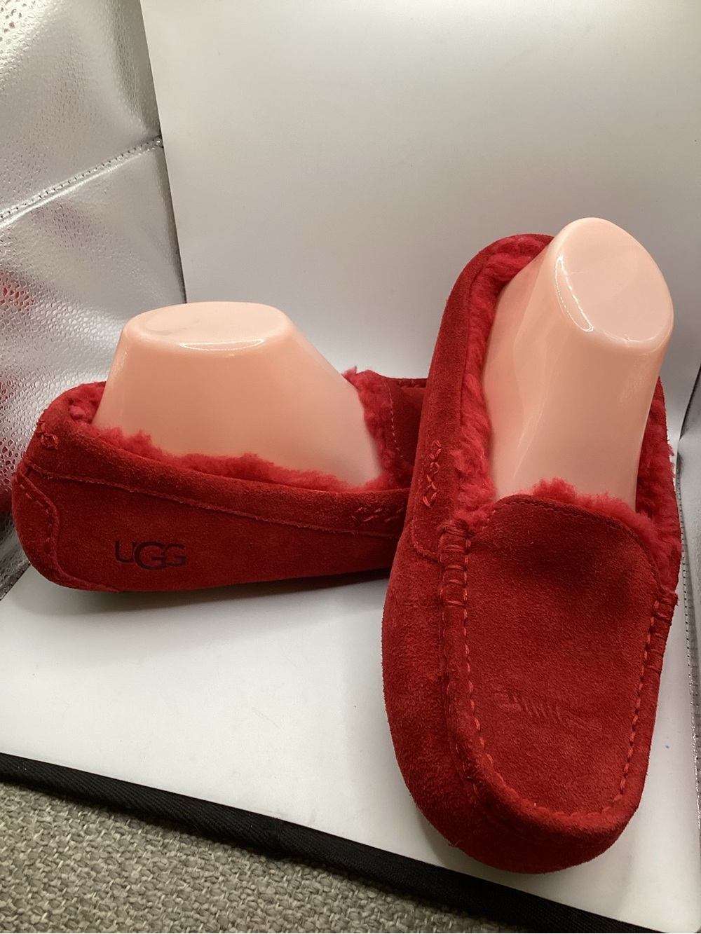 vibrant red suede UGG Ansley slippers with shearling interior